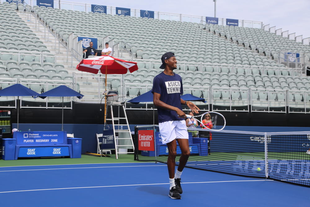 Chris Eubanks christens the new court for the Atlanta Open tournament. 