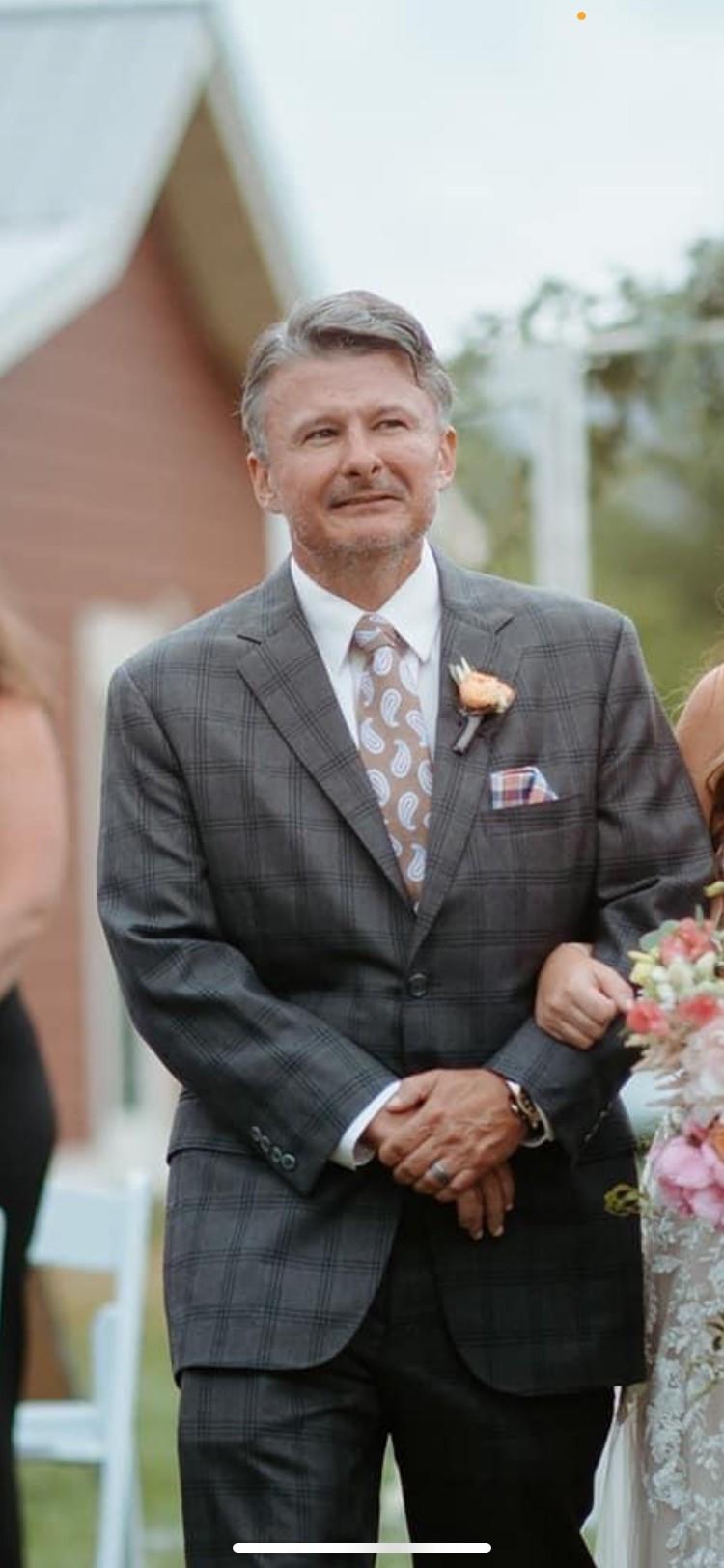 Jason Crawford is shown in a suit and tie for this posed photo.