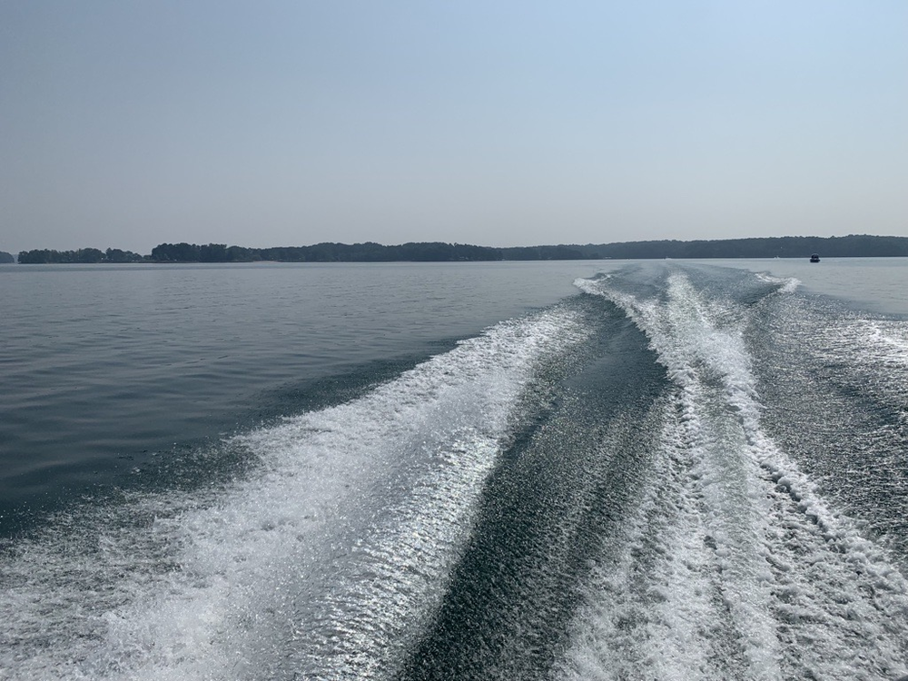 A boat's wake on Lake Lanier, June 29, 2023. The Georgia Department of Natural Resources calls the Fourth of July holiday weekend the busiest boating weekend of the year. The heat will likely increase those numbers, making it more dangerous as people head to the water to cool off. Credit Devon Zwald.