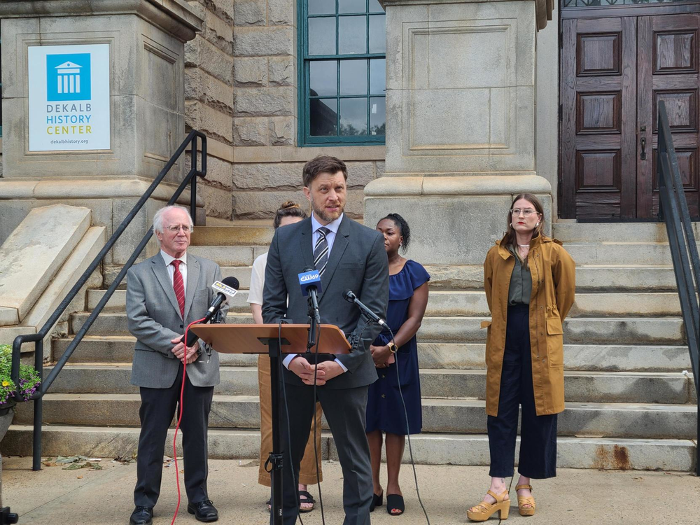 Attorney Jeff Filipovits joins four DeKalb residents at the DeKalb Courthouse in July 2023 to announce they filed a lawsuit against the city of Atlanta.