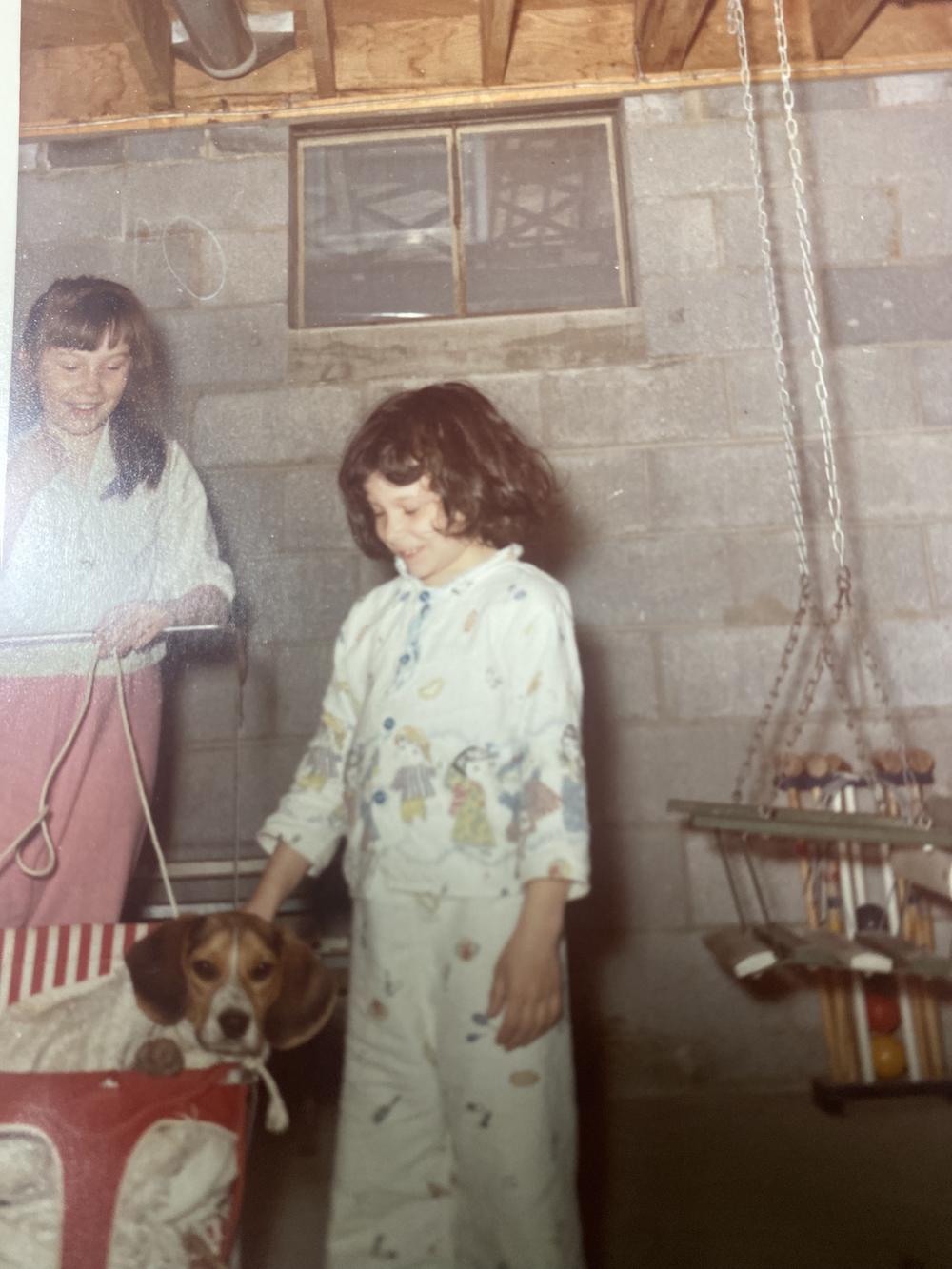 Sharon Collins (in the red pants) with her sister and Droopy. ("Every dog should have a baby carriage.")