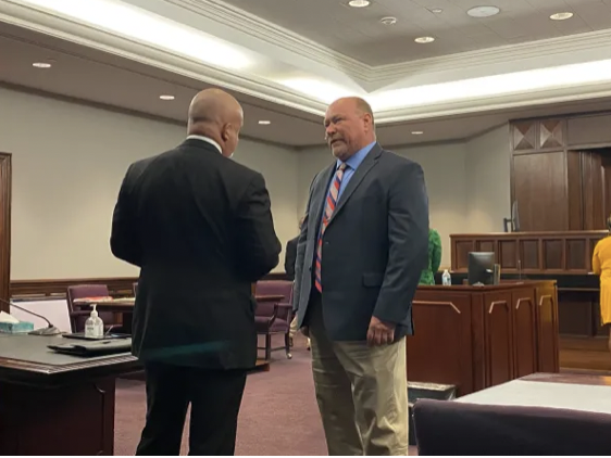 Former Glynn County Police Capt. David Hassler (right) in court speaking to his attorney Cris Schneider (left) after pleading guilty to a misdemeanor on Thursday, Mar. 2, 2023. Hassler was previously accused of perjury and making false statements related to the police drug unit’s misconduct. 