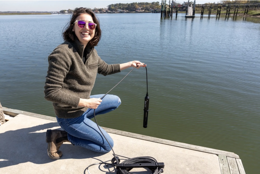 Mallory Mintz collecting water samples off the dock at Skidaway.