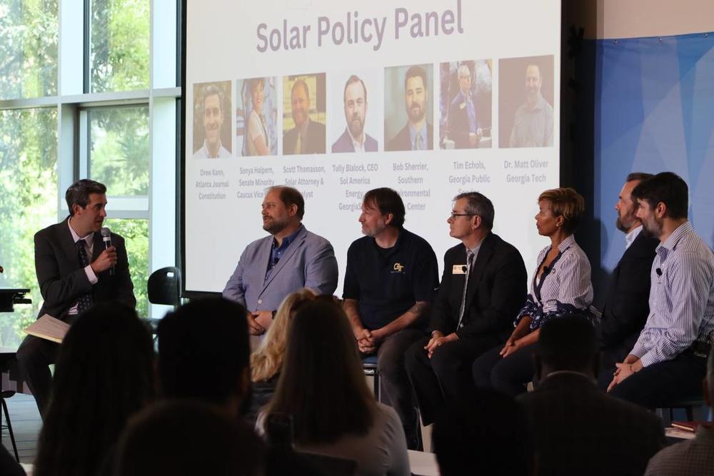 Solar Policy Panelists answer questions by moderator, Drew Kann at the “State of Solar” symposium in the Keneda building at Georgia Tech. From left to right (Drew Kann, Scott Thomasson, Dr. Matt Oliver, Tim Echols, Senator Sonya Halpern, Tully Blalock, Bob Sherrier).