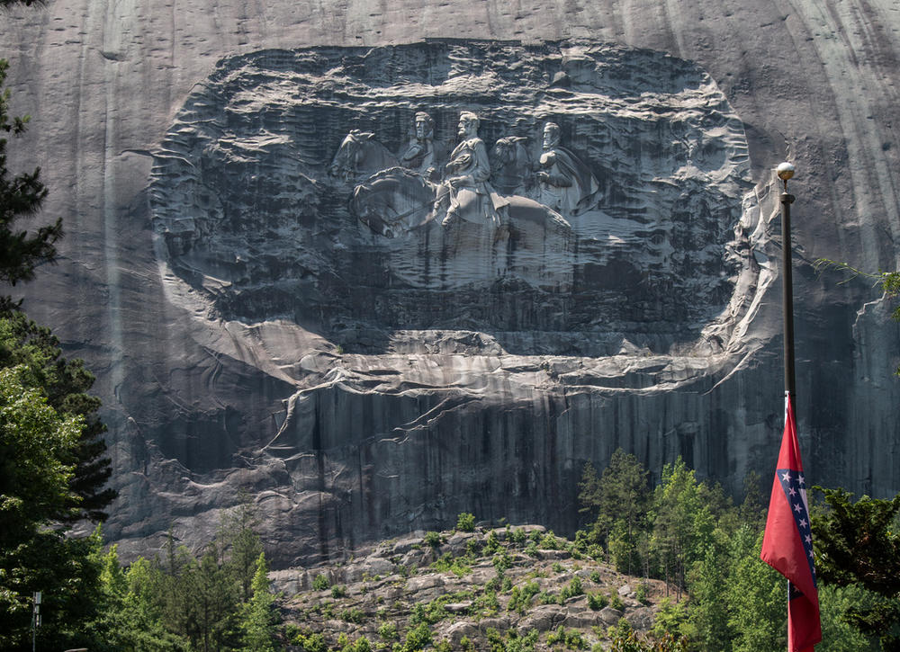A carving on Stone Mountain honoring Confederate generals is shown on Monday, May 24, 2021, in Stone Mountain, Ga. Civil rights groups are blasting a concert series with Black performers dubbed “Soul Fest” at a Georgia park with a giant carving of Confederate leaders. Stone Mountain Park just outside Atlanta is where the Ku Klux Klan marked its rebirth in 1915.