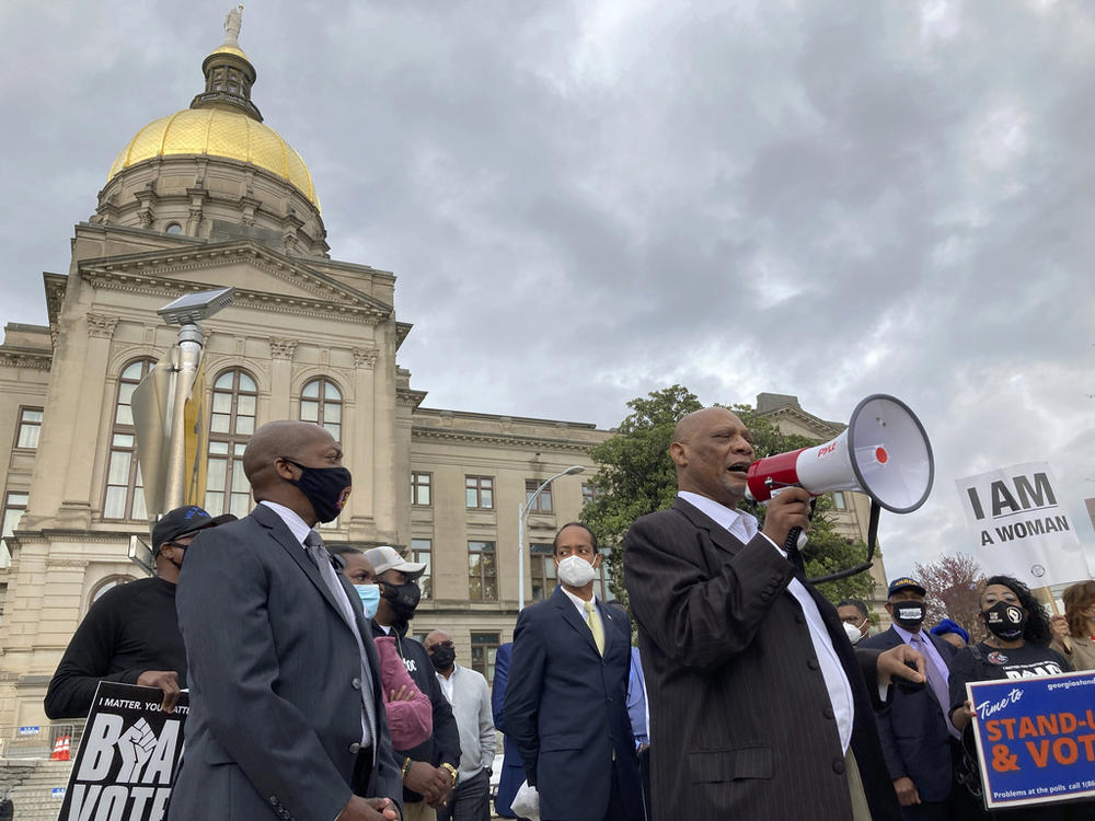  African Methodist Episcopal Church Bishop Reginald Jackson announces a boycott of Coca-Cola Co. products outside the Georgia Capitol on March 25, 2021 in Atlanta.