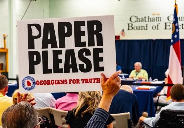 Activists attending a meeting of the Chatham County Election Board call for replacing voting machines with paper ballots, Monday, July 10, 2023. (Craig Nelson)