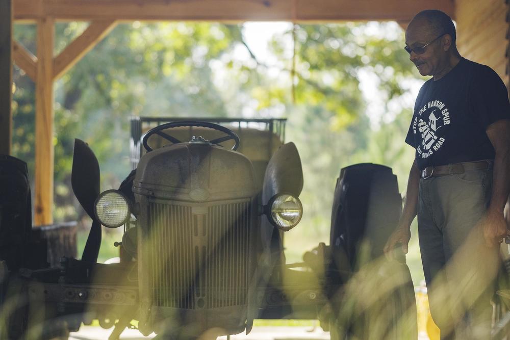 Mark Smith with the 1948 Ford tractor which belonged to his grandfather and with which he still farms today.