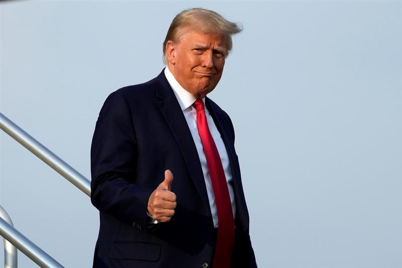 Former President Donald Trump steps off his plane as he arrives at Hartsfield-Jackson Atlanta International Airport, Thursday, Aug. 24, 2023, in Atlanta. Trump is headed to the Fulton County Jail.