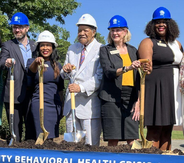  Speaker Pro Tem Jan Jones (second from right), a Milton Republican, shares a shovel with Rep. Mandisha Thomas, a South Fulton Democrat, at a groundbreaking Monday for Fulton County’s first behavioral health crisis center. Also pictured: Sen. Josh McLaurin, Rep. Tanya Miller and Fulton County Chairman Robb Pitts. 
