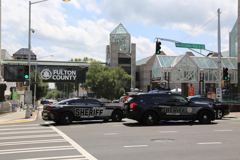 Fulton County Sheriff's cars block off Pryor Street. 