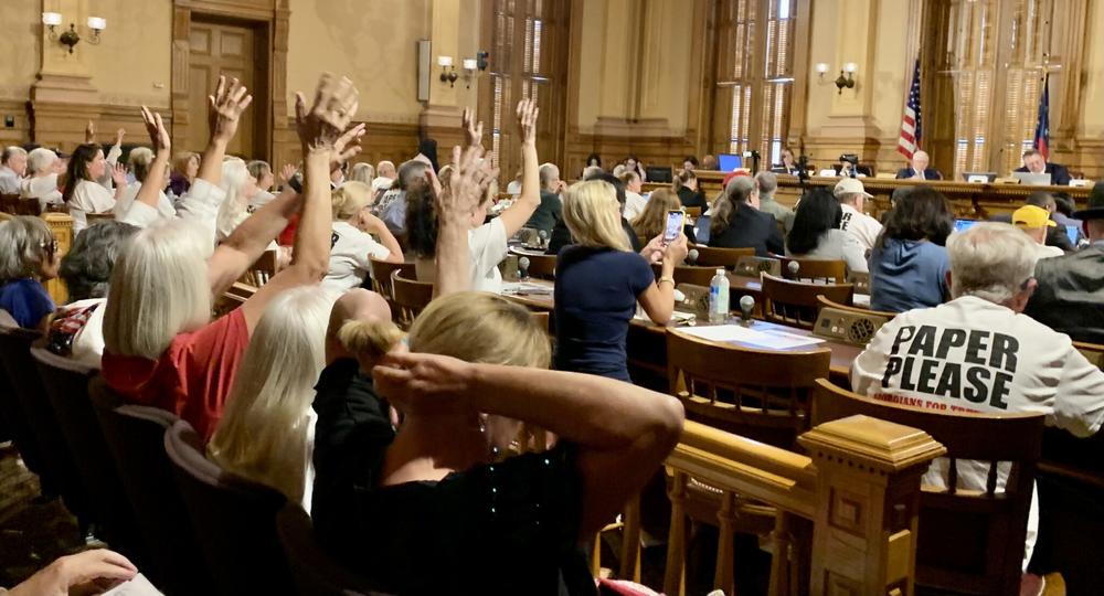 At a Georgia State Election Board meeting on Aug. 1, more than 100 people gathered inside the state Capitol to pressure election officials to switch to paper ballots before the 2024 election. Stanley Dunlap/Georgia Recorder