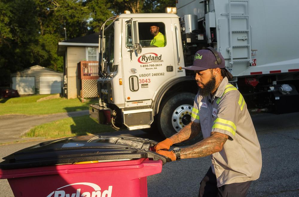 Sanitation worker Chris Powell on one of his regular routes in Macon, Ga.  