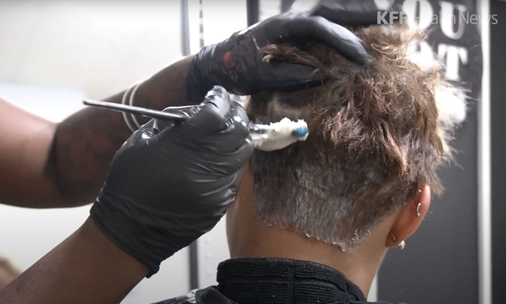 A beautician applies a relaxer on a client’s hair at a salon in Atlanta. Social and economic pressures have long compelled Black girls and women to straighten their hair. But mounting evidence suggests chemical hair straighteners could be a health hazard.