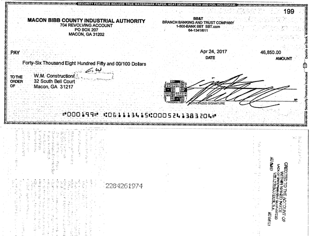 This copy of a canceled check released by the Macon-Bibb County Industrial Authority shows the initials C.W. over a change to the payee line.