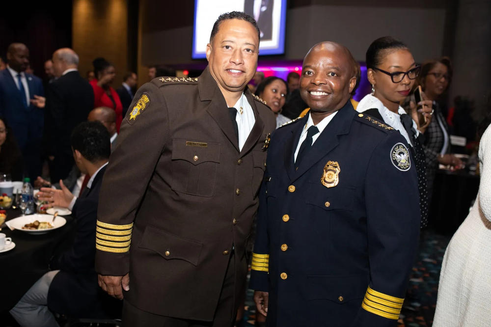 Fulton County Sheriff Patrick Labat and former Atlanta Police Chief Rodney Bryant attend the State of the City Address at the Georgia World Congress Center on Monday, April 4, 2022. 