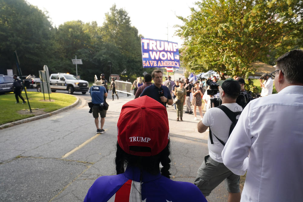 Former President Donald Trump's supporters gather outside of the Fulton County Jail, Thursday, Aug. 24, 2023, in Atlanta.