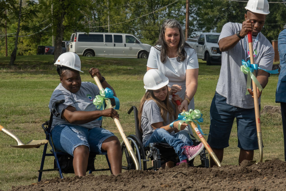 Members of the River Edge 'See Me, Hear Me' advocacy group help with the groundbreaking of the new crisis stabilization diagnostic center in Macon.