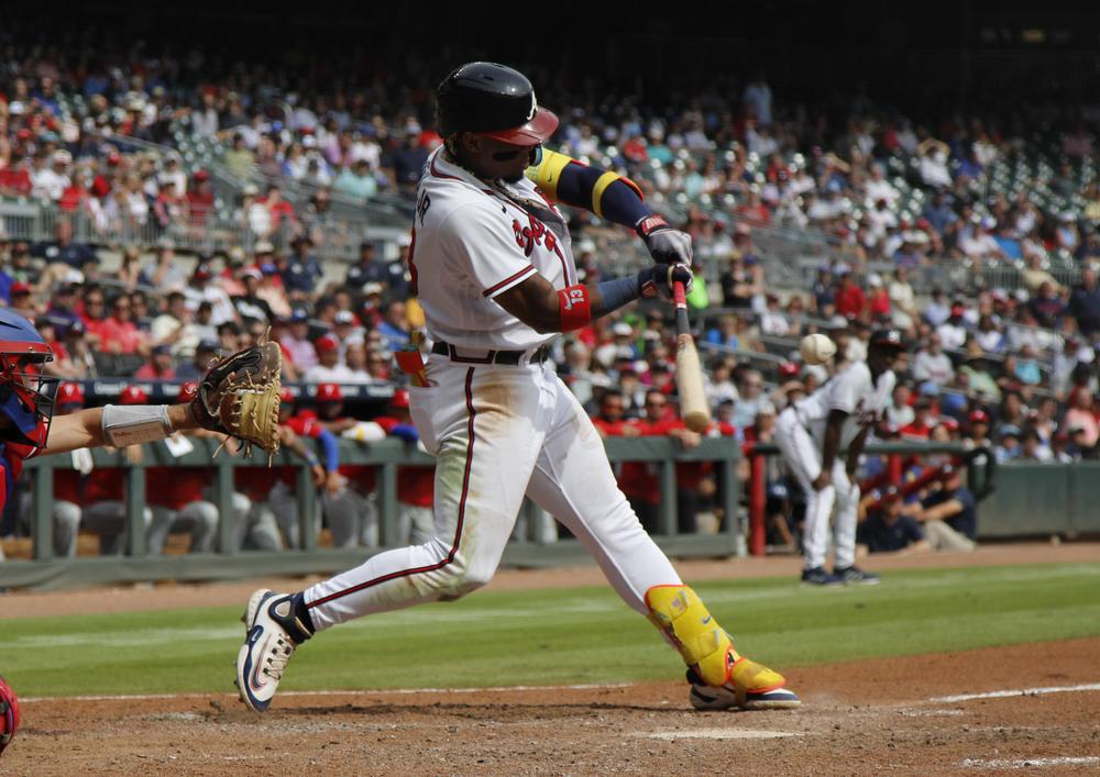 Ronald Acuña Jr. makes contact during a game against the Philadelphia Phillies at Truist Park in Atlanta, Sept. 20, 2023. 