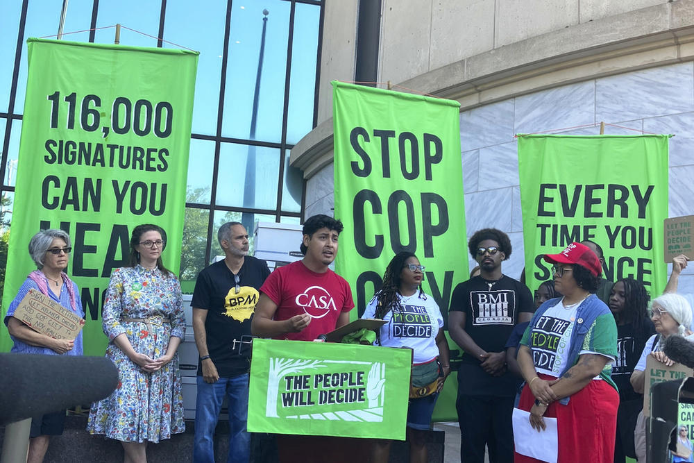 Activist Alberto Feregrino speaks at a news conference outside Atlanta City Hall, Monday, Sept. 11, 2023, to celebrate the gathering of what organizers said was 116,000 signatures to force a referendum on the future of a planned police and firefighter training center. Shortly after, though, Atlanta officials refused to accept the paperwork for processing, saying the city is awaiting a court decision over whether the petitions had been turned in on time. 