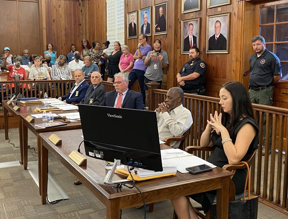 From left to right, McIntosh County Commissioners Davis Poole, William Harrell, David Stevens, Roger Lotson and Kate Karwacki sit for a board meeting at the McIntosh County Courthouse on Tuesday, Sept. 12, 2023.