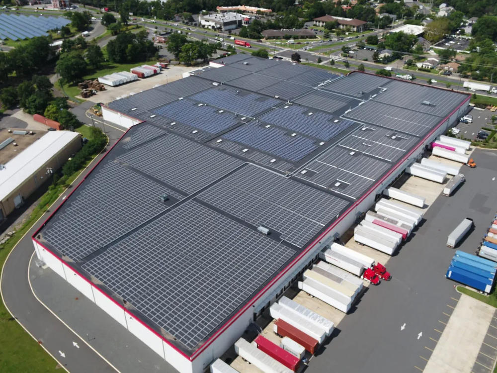 This Edison, N.J., roof shows an example of a behind-the-meter traditional commercial solar project and a community solar project on the same warehouse rooftop.