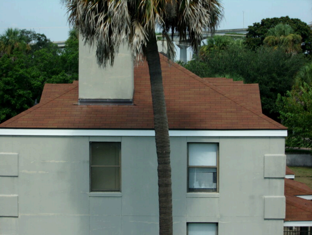 An apartment building at Yamacraw Village in Savannah is seen with asphalt shingle roofing, which was installed in 2019 and noted by AEI Consultants as the only significant capital expenditure undertaken at the public housing complex in the past five years.