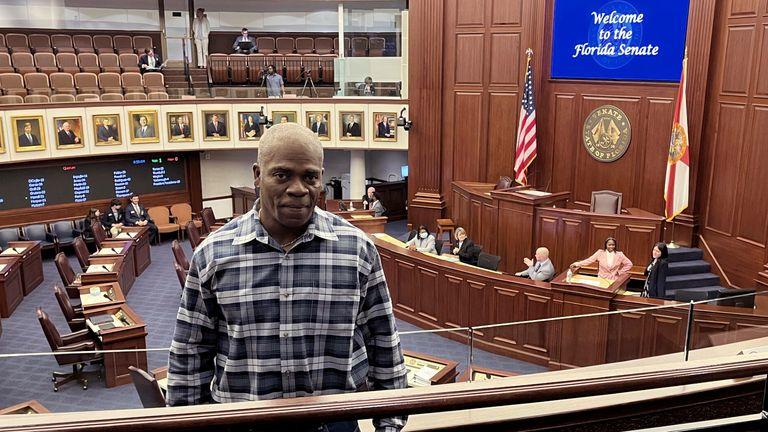 In this photo provided by the Innocence Project of Florida, Leonard Allen Cure poses from the floor of the Florida legislature in Tallahassee, Fla., in April 2023, on the day his compensation bill was passed. Cure, who spent more than 16 years in prison in Florida on a wrongful conviction, was shot and killed Monday, Oct. 156, by a sheriff's deputy in Georgia during a traffic stop, authorities and representatives said.