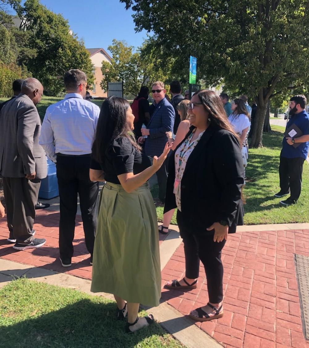 Muskogee (Creek) Nation Acting Secretary of Culture and Humanities RaeLynn Butler, right, greets Tracie Revis, the Director of Advocacy for the Ocmulgee National Park & Preserve Initiative, during the recent Ocmulgee to Okmulgee tour. (Liz Fabian)