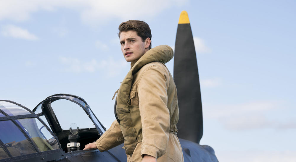 A man about to enter a fighter plane.
