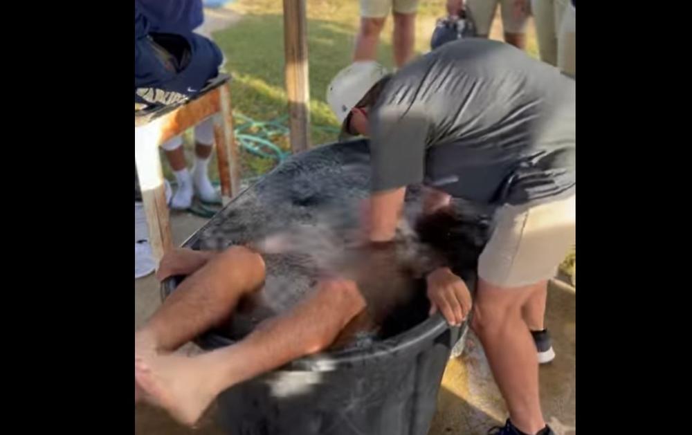 A video posted to Facebook shows one of several students at Tattnall County High School getting baptized after practice on October 23, 2023.