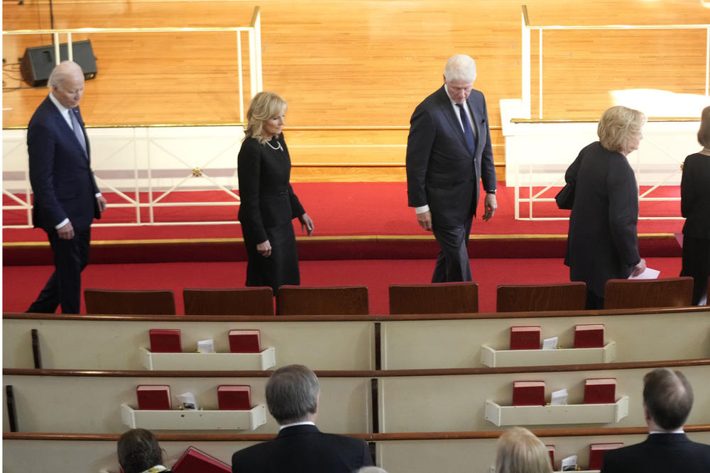 President Joe Biden, left, first lady Jill Biden, for President Bill Clinton and former first lady Hillary Clinton, right, arrive to attend a tribute service for former first lady Rosalynn Carter at Glenn Memorial Church, Tuesday, Nov. 28, 2023, in Atlanta.