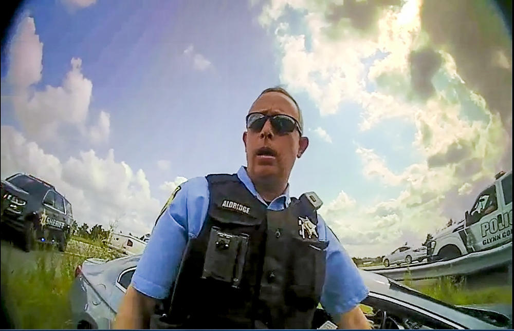 A still image from a deputy’s body camera video provided by the Camden County Sheriff's Office shows Staff Sgt. Buck Aldridge following a chase and arrest on June 24, 2022.