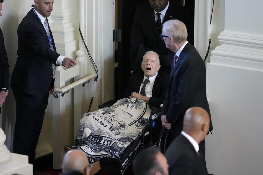 Former President Jimmy Carter, arrives to attend a tribute service for his wife and former first lady Rosalynn Carter, at Glenn Memorial Church, Tuesday, Nov. 28, 2023, in Atlanta. 