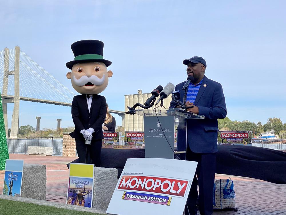 Accompanied by “Mr. Monopoly,” Savannah Mayor Van Johnson speaks at an event along the city's downtown riverfront on Tuesday, Nov. 14, 2023, to reveal the new Savannah edition of Monopoly.