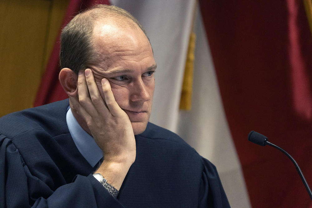 FILE - Judge Scott McAfee presides over a hearing for Harrison Floyd at the Fulton County Courthouse, Nov. 3, 2023, in Atlanta. McAfee is set to hear arguments on a request to revoke the bond of Harrison Floyd, one of former President Donald Trump's codefendants in the Georgia case related to efforts to overturn the 2020 election. Fulton County District Attorney Fani Willis last week filed a motion asking McAfee to revoke the bond of Floyd. (Christian Monterrosa/Pool Photo via AP, File)