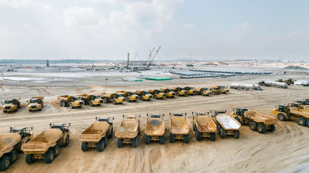Dump trucks sit waiting at the 3,000-acre Hyundai Metaplant site. Credit: Justin Taylor/The Current