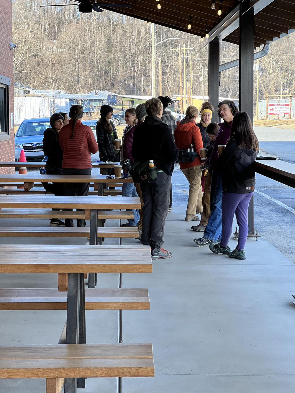Group gathered outside Old Fort Bike Shop for a day of volunteer trail maintenance