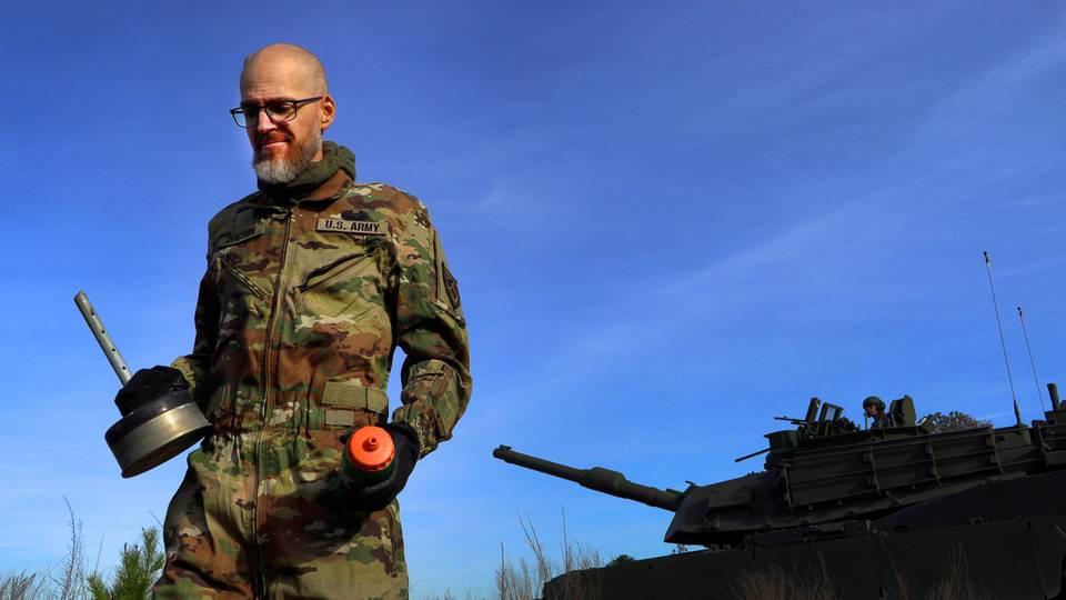Jay Tenison, a military veteran currently fighting Stage IV stomach cancer, fires a tank Tuesday afternoon at Fort Moore, Georgia. 