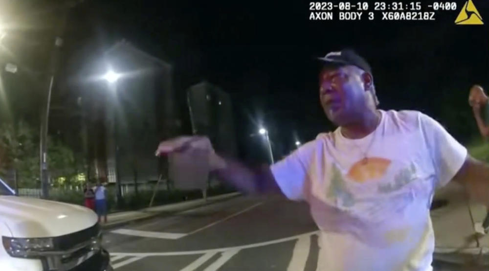 This image from bodycam video provided by the Atlanta Police Department shows Johnny Hollman Sr. speaking with Officer Kiran Kimbrough on Aug. 10, 2023 in Atlanta. The police officer responding to a minor car crash deployed a Taser on the church deacon who disregarded multiple commands to sign a traffic ticket, shocking the man after he repeatedly said he could not breathe, police body camera video released Wednesday, Nov. 22, 2023 shows. Hollman Sr. became unresponsive during his arrest and later died.