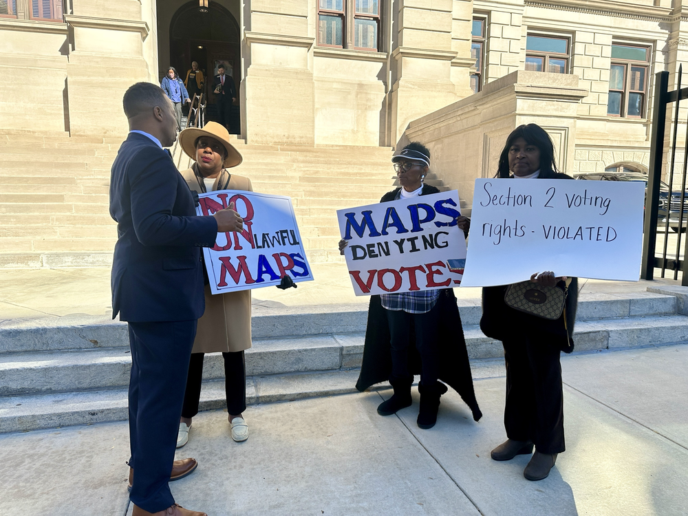 A few protesters gathered at the Georgia capitol to speak out against the redistricting maps created by Republicans and approved by the Georgia Senate on Dec. 5, 2023. 