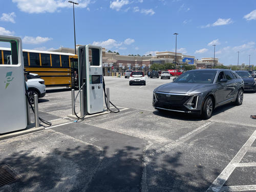 This charging station in Grovetown, Ga., was overcrowded. An electric school bus that was driving on a statewide clean-energy road show needed one charger; another charger was broken.