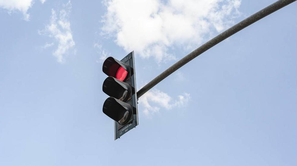 Under Georgia law, drivers cannot run a red light that is taking too long to turn green. Drivers can be penalized with a fine for disobeying a traffic signal.