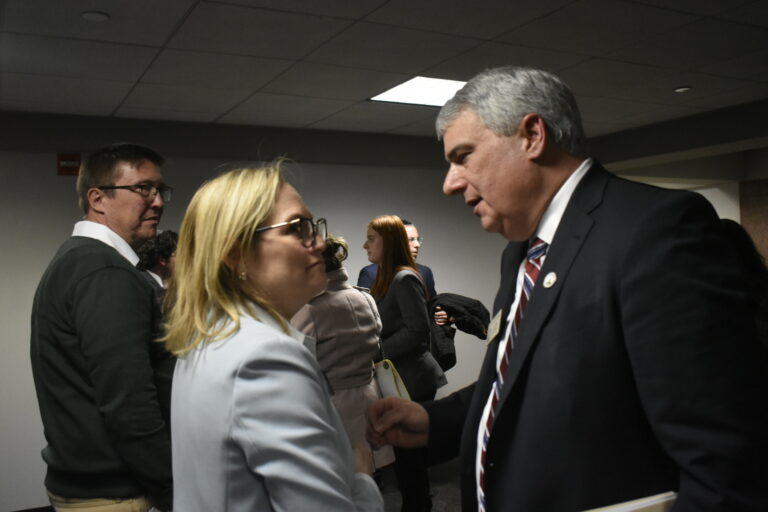 State Reps. Esther Panitch and John Carson speak in the hallway after the Senate Judicial Committee passed Carson’s antisemitism bill. The only current Jewish member of the Legislature, Panitch has pushed hard for the bill’s passage and said she was grateful to see it moving forward Monday. 