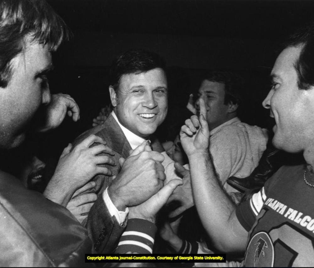 Leeman Bennett with Bill and Steve Belichick. Coach Bennett was a member of the Navy football staff that included Steve, the father of the future New England coaching legend.