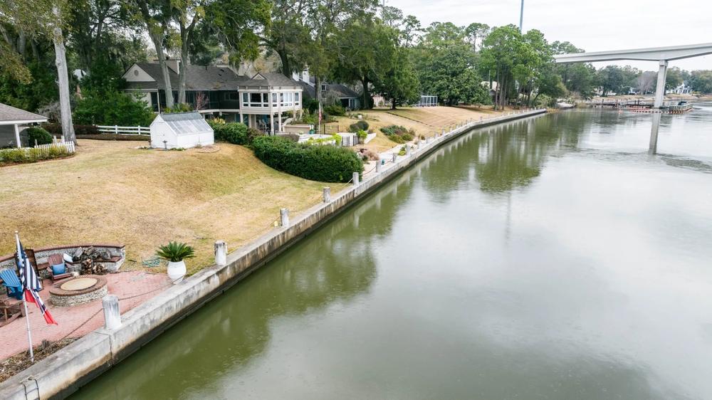 A bulkhead runs along the bank of the Intracoastal Waterway near the Causton Bluff Bridge. Credit: Justin Taylor/The Current
