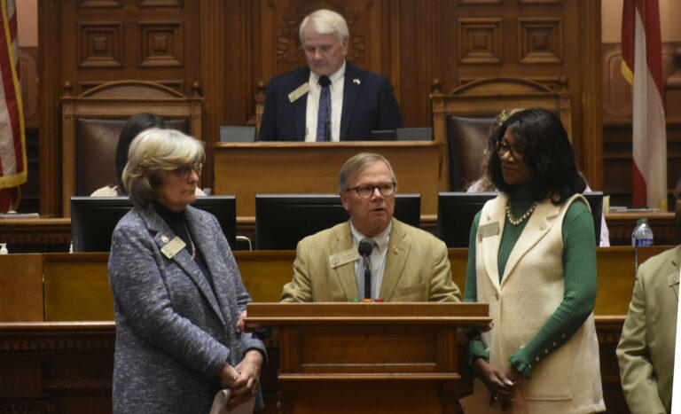 Members of the Columbus delegation, from left, Reps. Debbie Buckner, Vance Smith and Carolyn Hugley, eulogize Rep. Richard Smith. Ross Williams/Georgia Recorder.