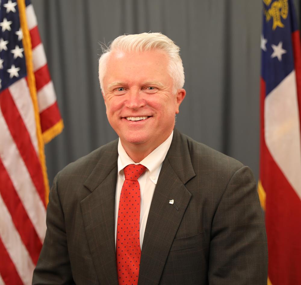 An official photo of Randy Robertson is shown.