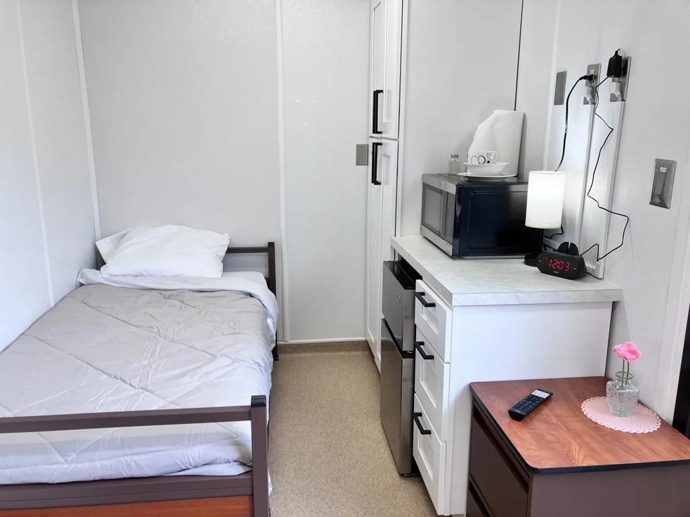 The 40 micro-units of Atlanta’s first rapid housing community for unhoused people includes a bed, kitchenette and bathroom. (Dyana Bagby)