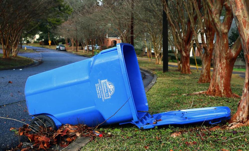 An empty blue recycling bin on Wildwood Avenue was knocked over from the recent storms moving through Columbus. 01/09/2024 Kala Hunter khunter@ledger-enquirer.com 